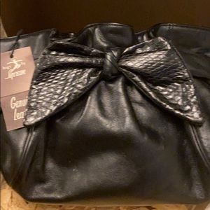 Black leather clutch with bow